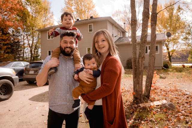Family in front of their home